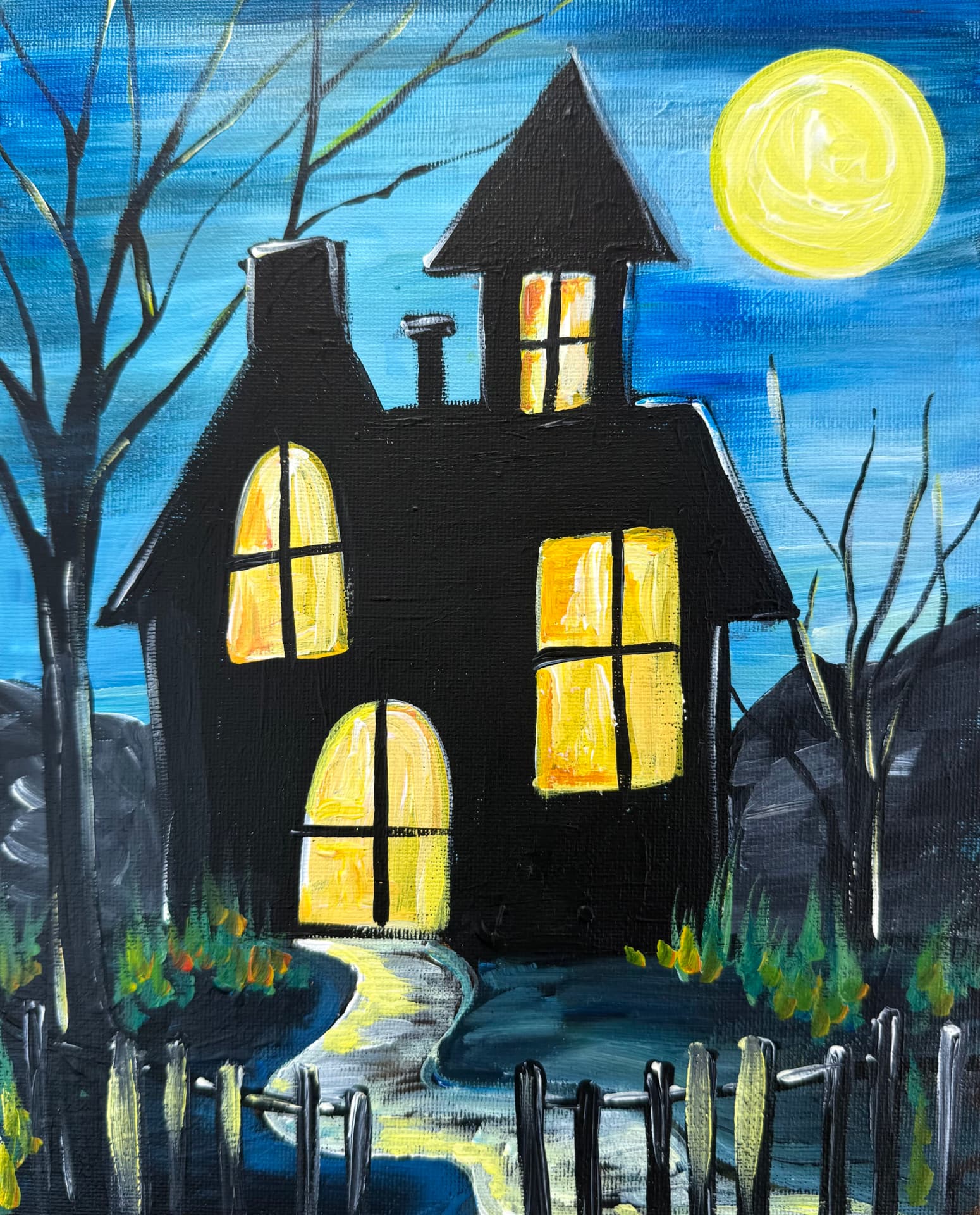 Acrylic painting of a haunted house with glowing windows at night