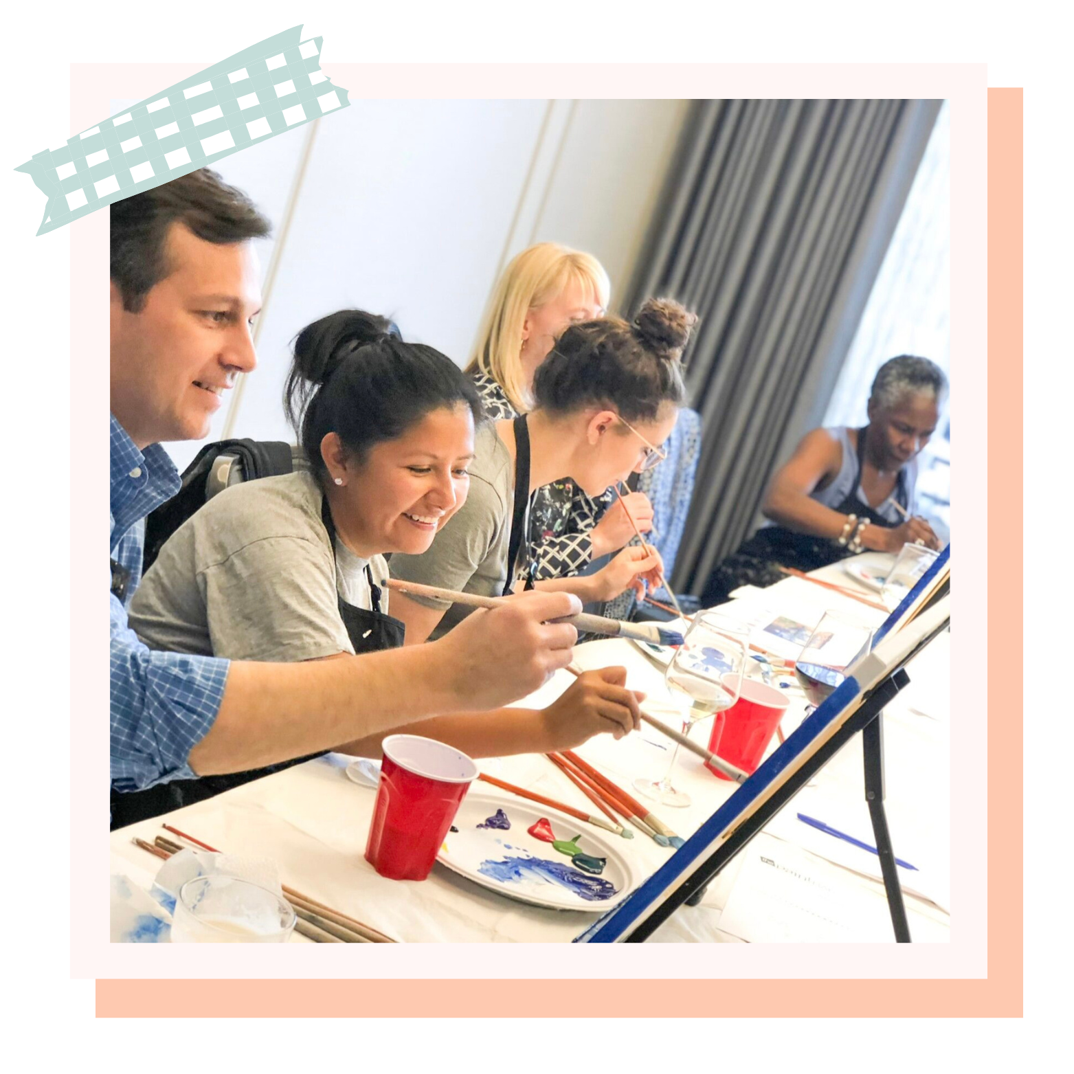 Coworkers painting together at a Paint Bar corporate event